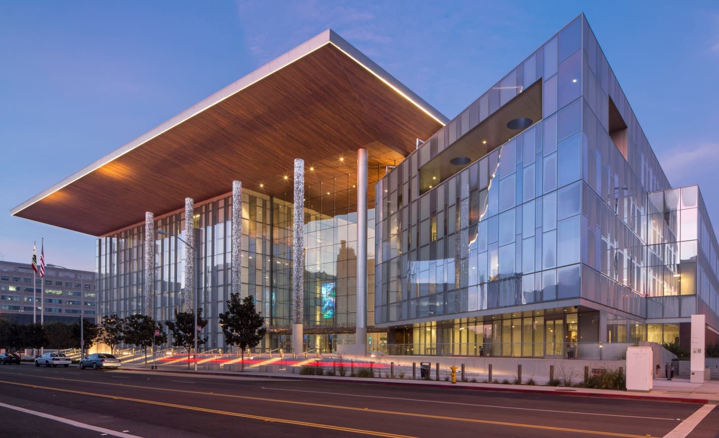 The George Deukmejian Courthouse in Long Beach at dusk, delivered through a DBFOM public-private partnership